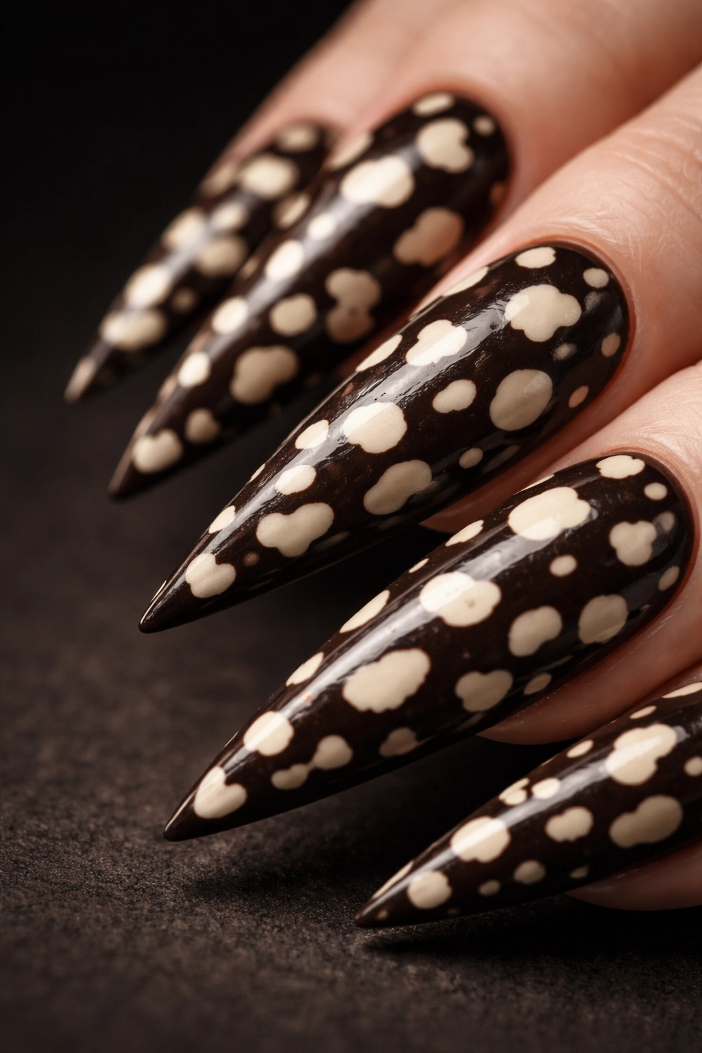 Dark espresso cheetah nail with light cream spots in reverse print