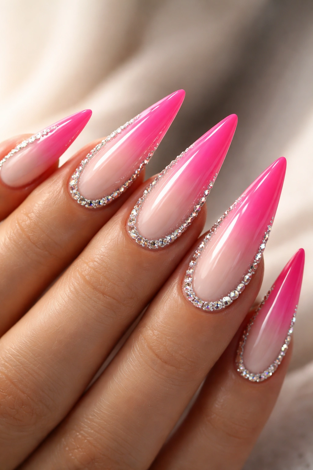 Reverse ombre nails with rhinestone border on stiletto shape