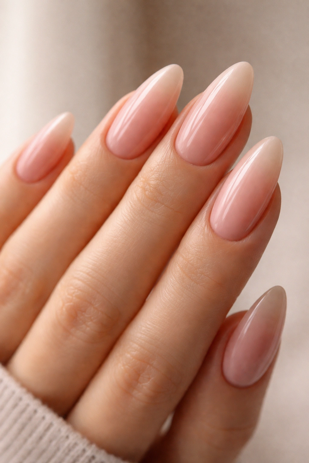 Close-up of rose milk almond nails