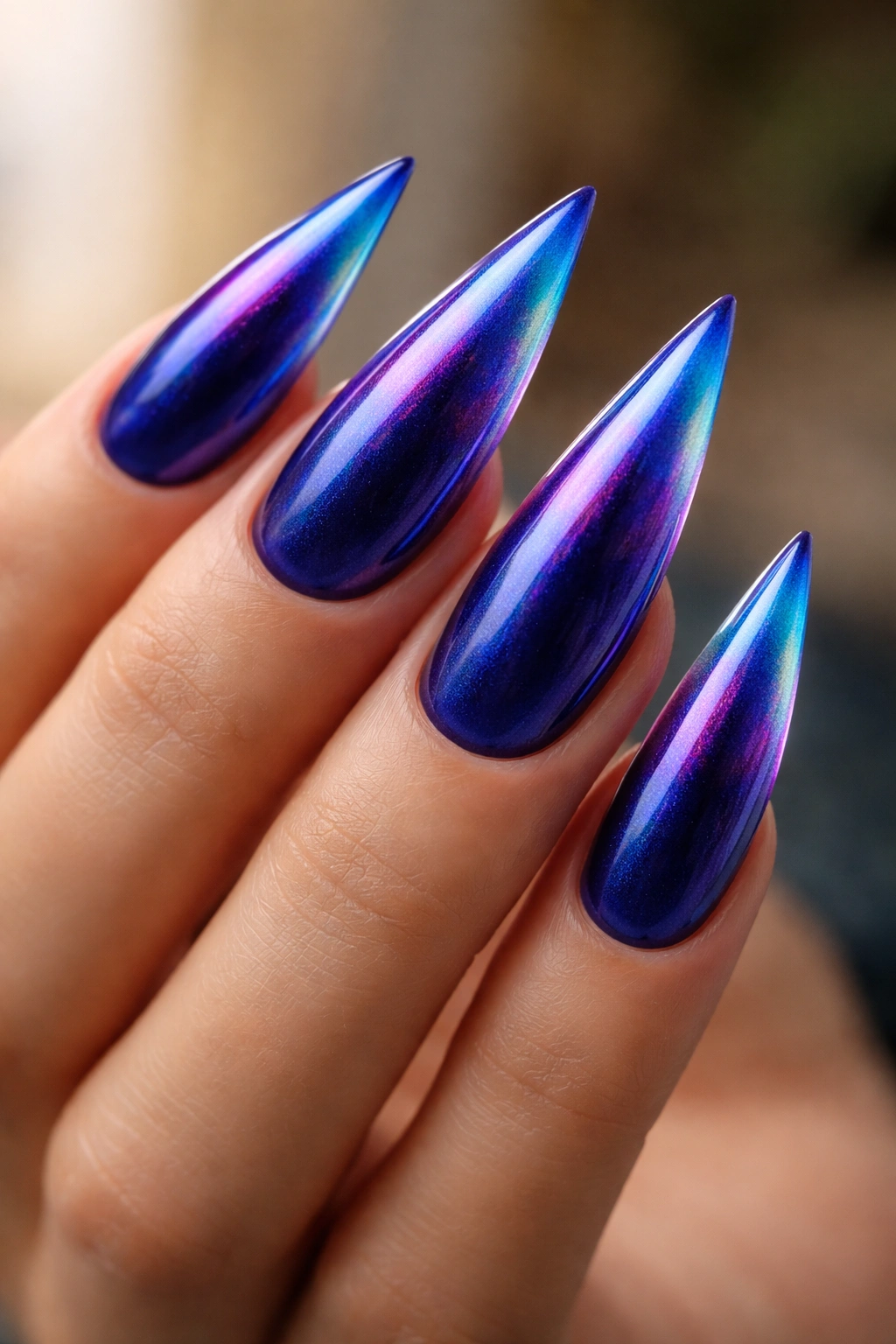 Close-up of royal blue nails with aura shifting glow