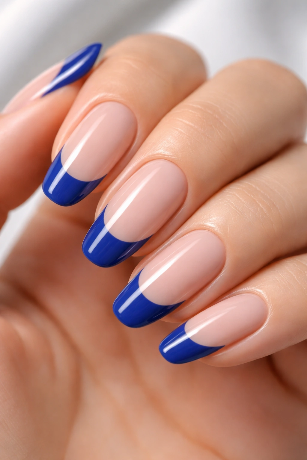 Royal blue French tip nails with crisp blue tips