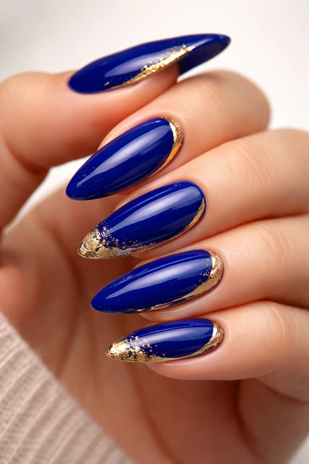 Royal blue nails with gold accents