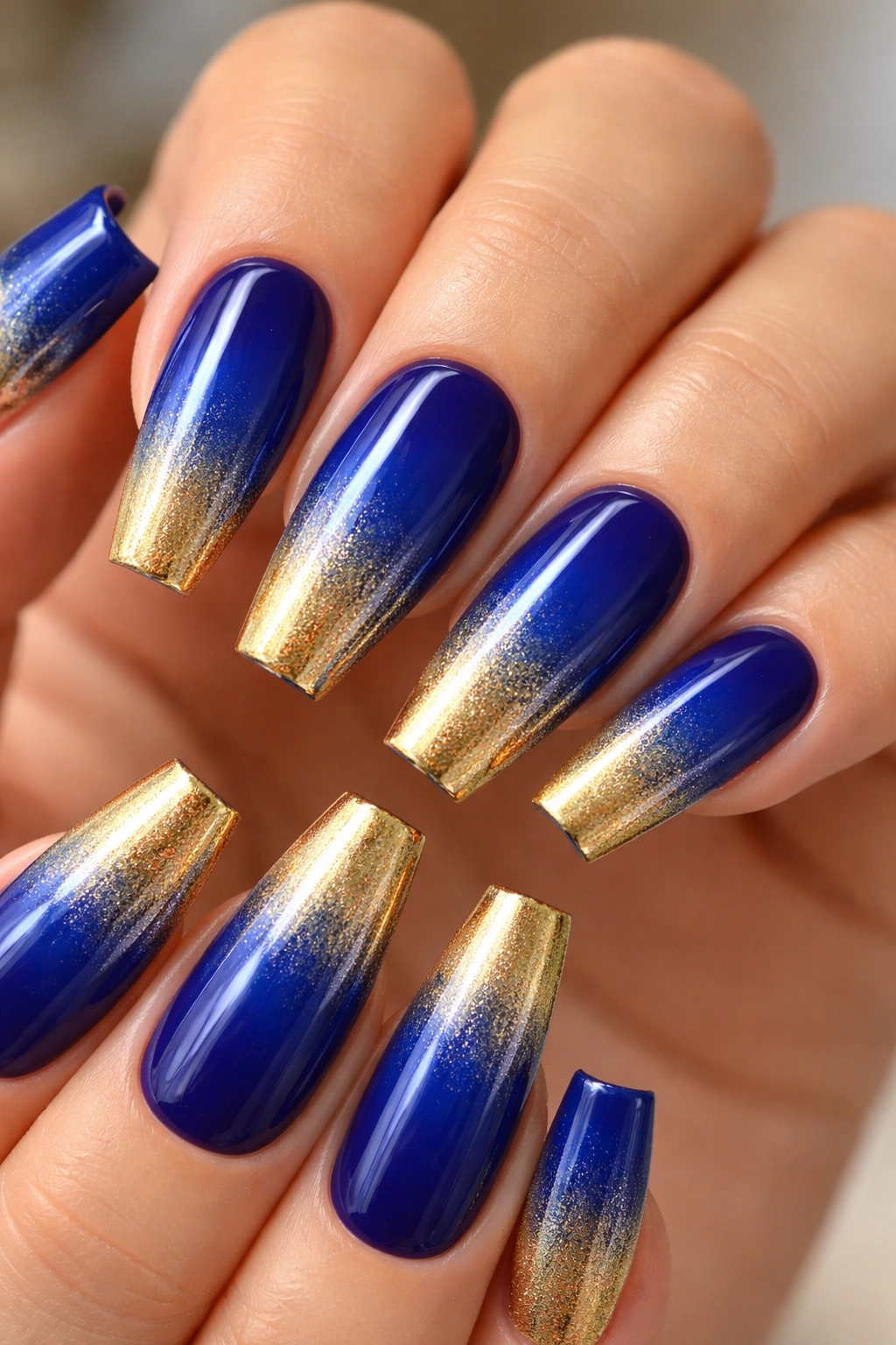 Coffin nails with royal blue to gold gradient, glossy finish