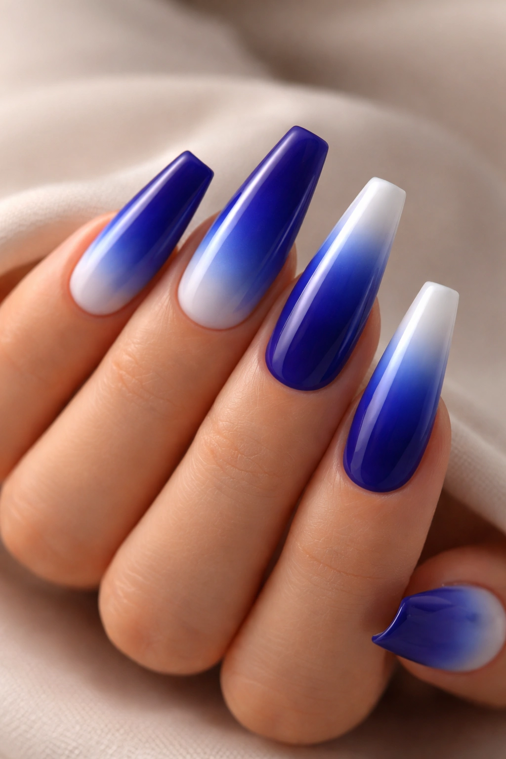 Coffin nails with royal blue to white ombre gradient