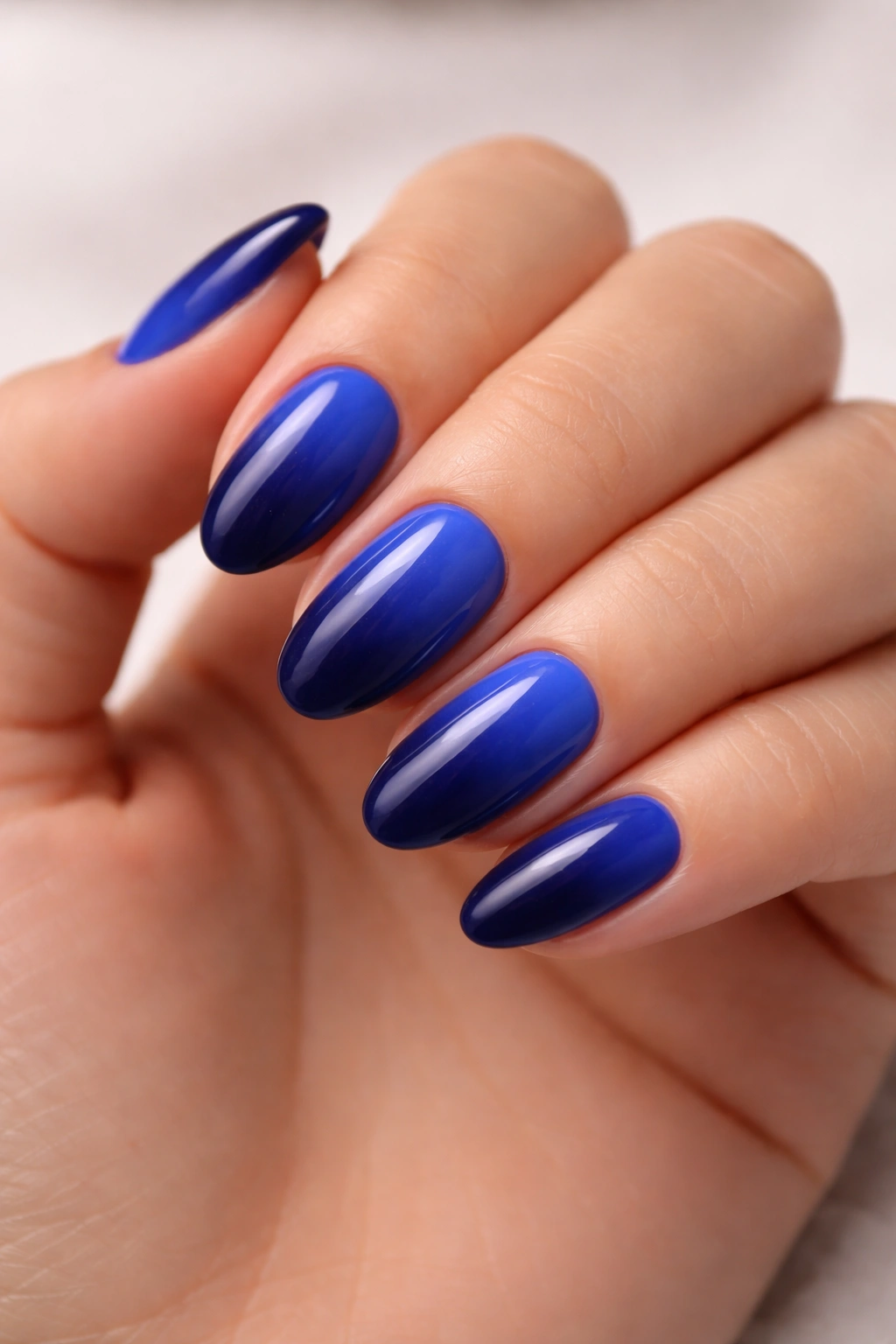 Navy and royal blue ombré on short almond nails