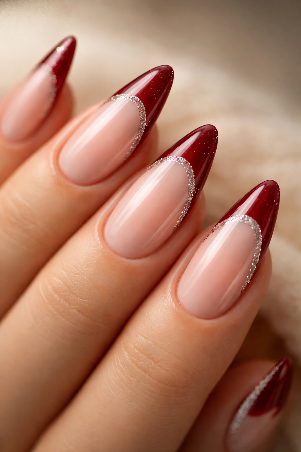 Almond nails with ruby red tips and crystal glitter rim
