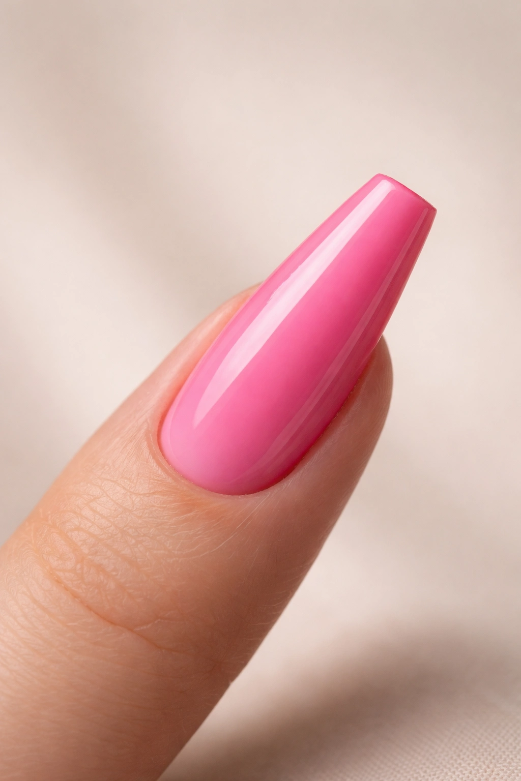 Side-profile nail showing straight sidewalls and tapered shape for salon consultation