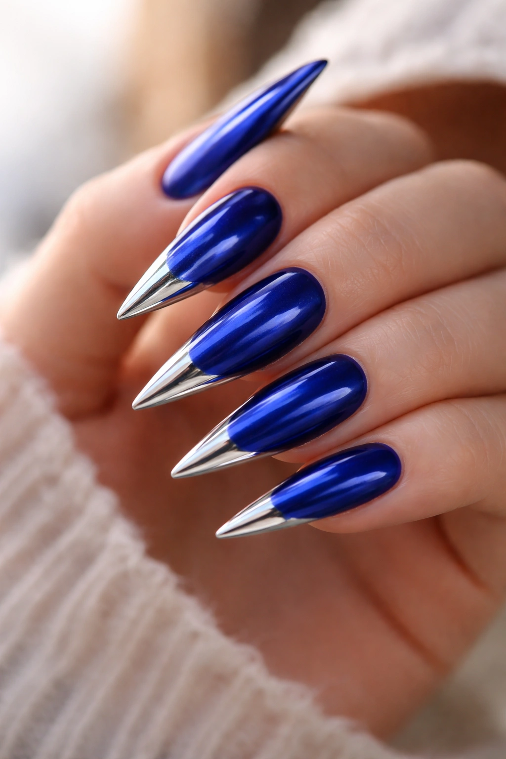 Sapphire blue stiletto nails with chrome tips