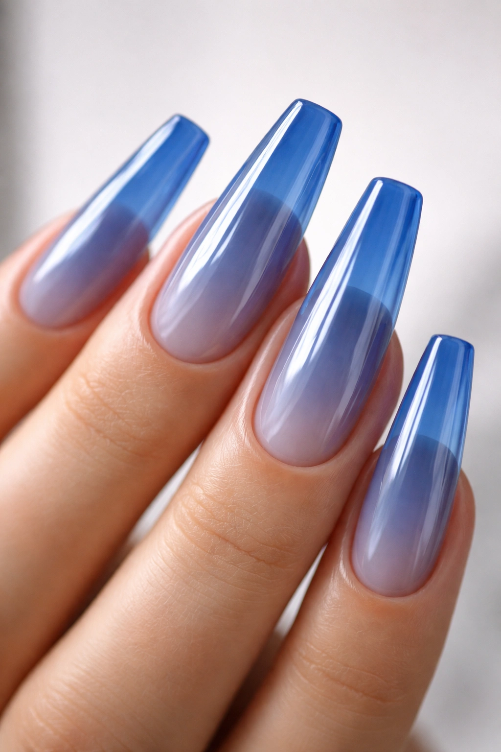 Sapphire jelly nails translucent blue on ballerina shaped nails