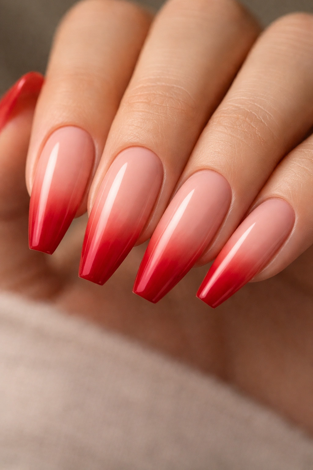 Nude-to-scarlet fade on a ballerina nail