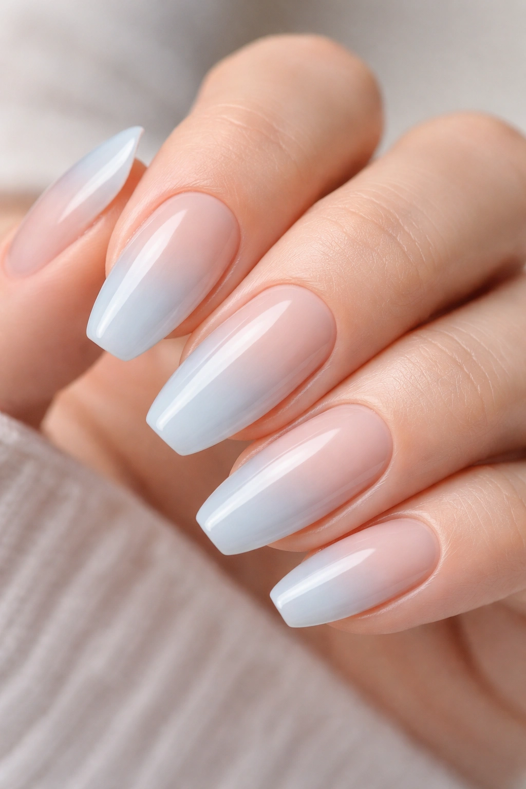 Nails with sheer blue over nude base showing subtle undertones