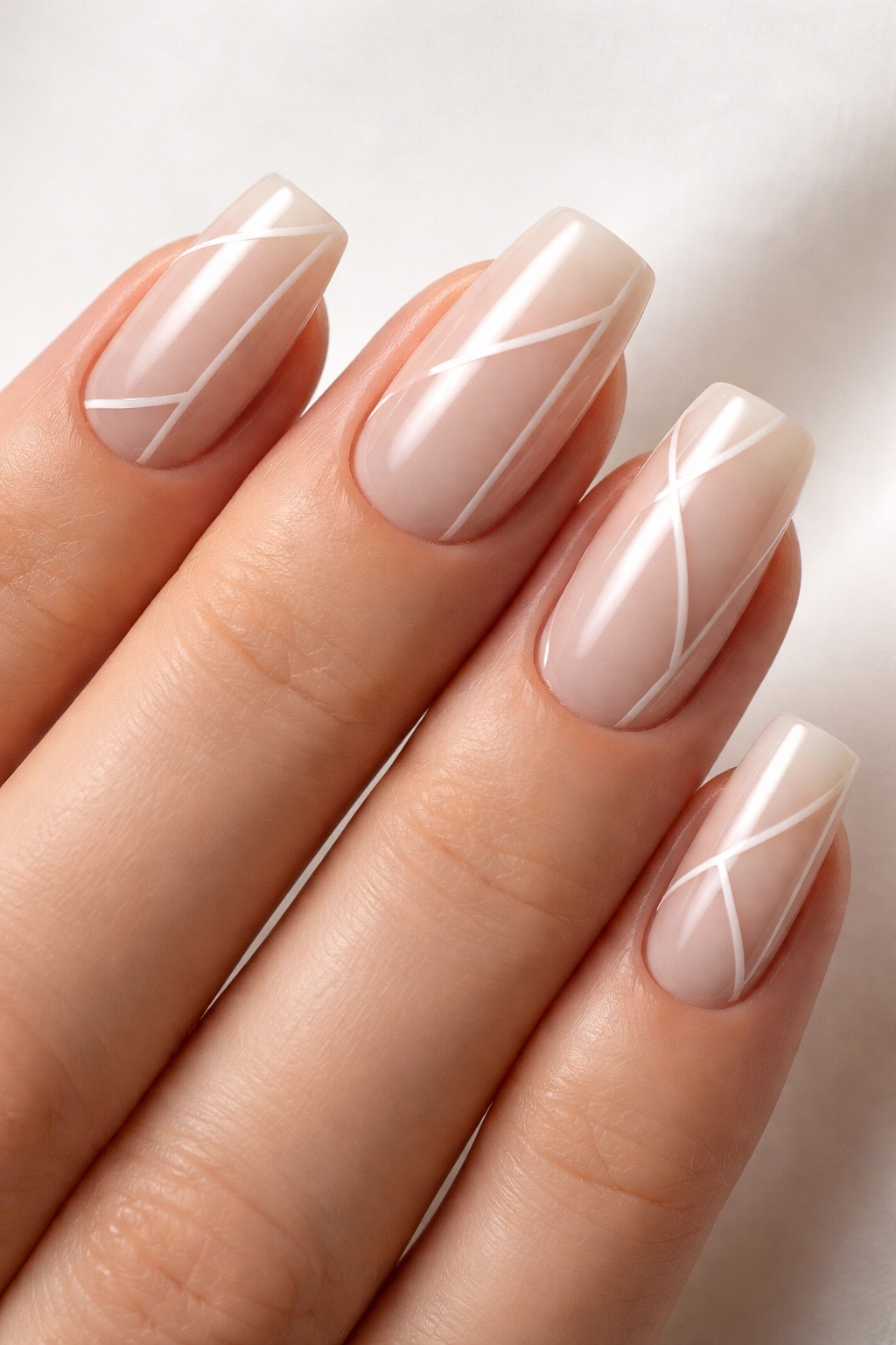 Sheer nude nails with negative space design on soft square nails