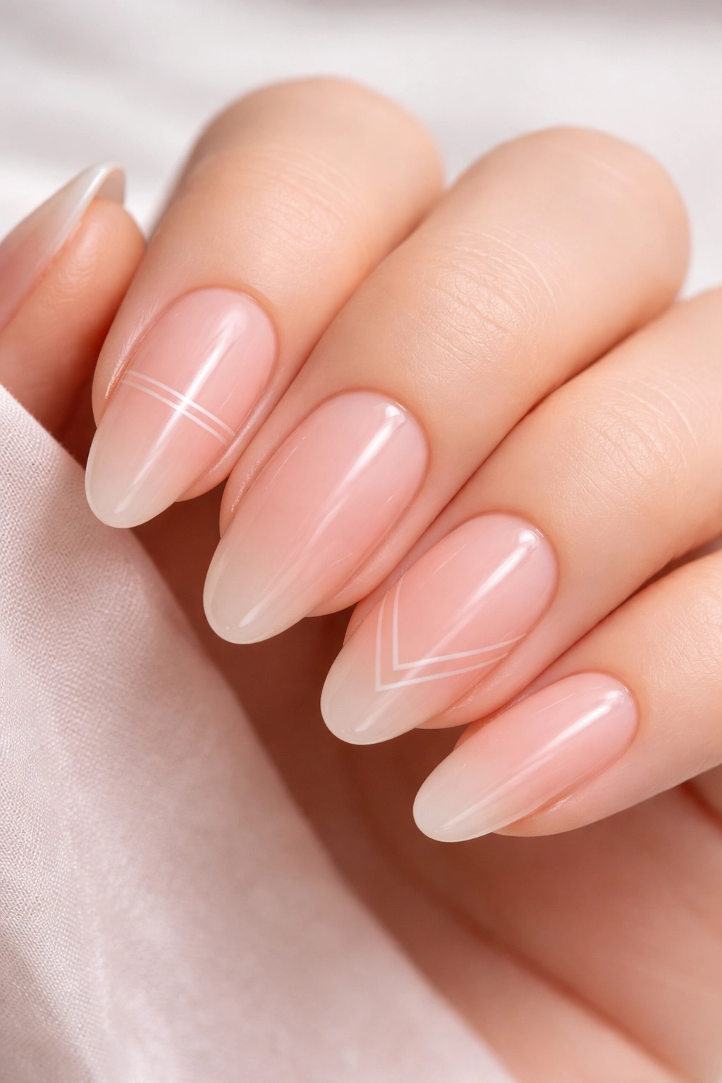 Long oval nails sheer pink with white line art on accent nails