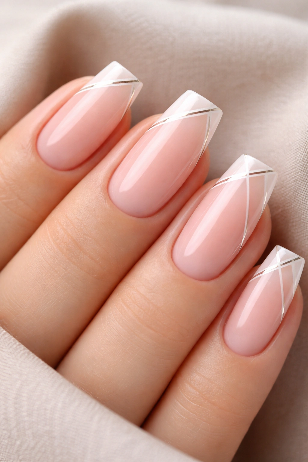 Close-up of sheer pink soft square nails with geometric tips
