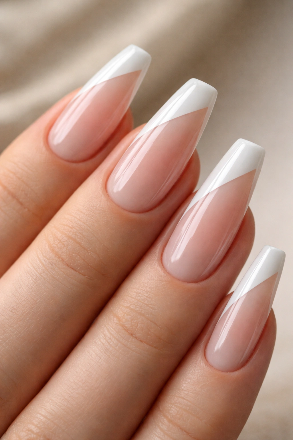 Close-up of side-swept diagonal French tip on ballerina nail