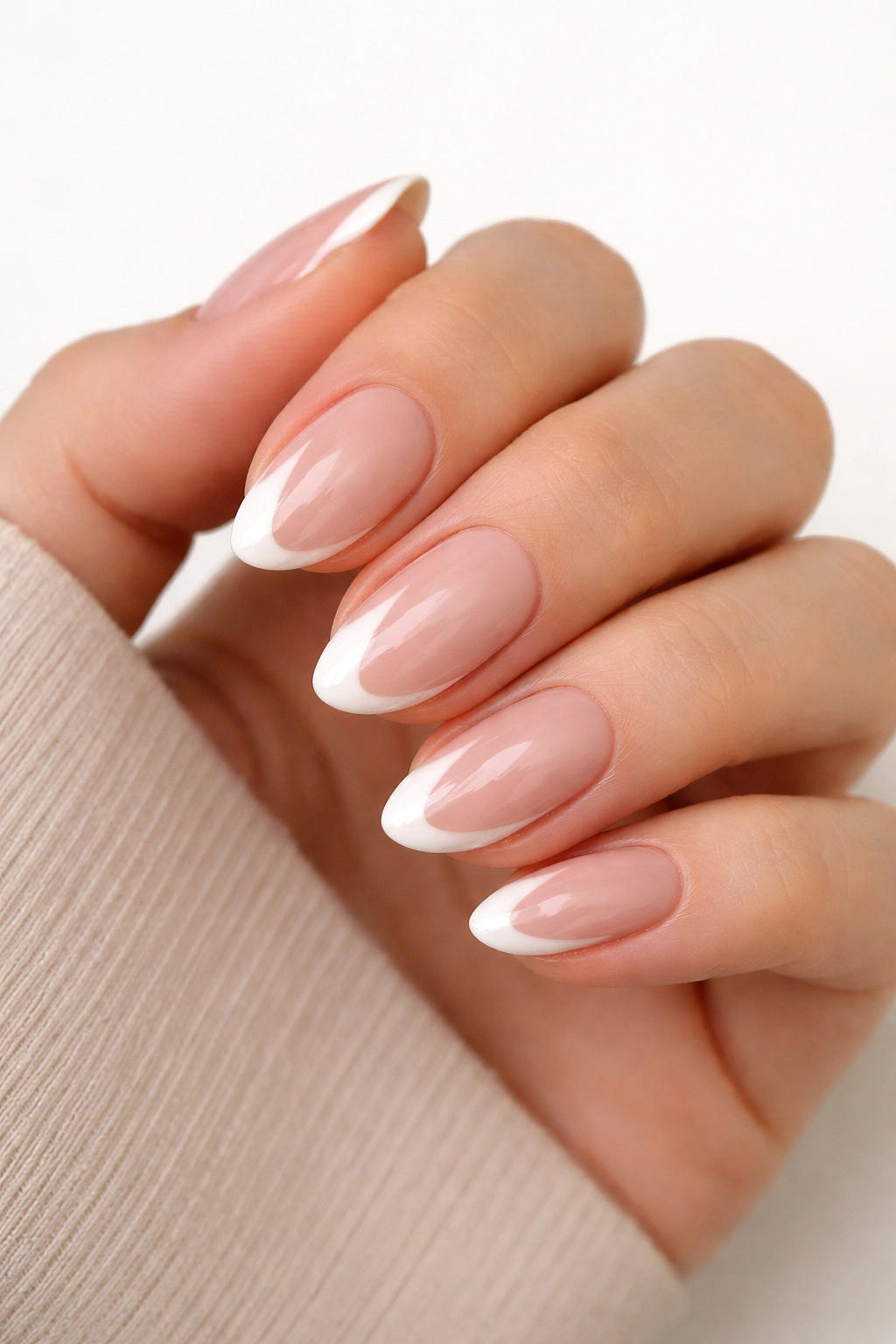 Close-up of short almond nails with a side-tip on the right side of each nail