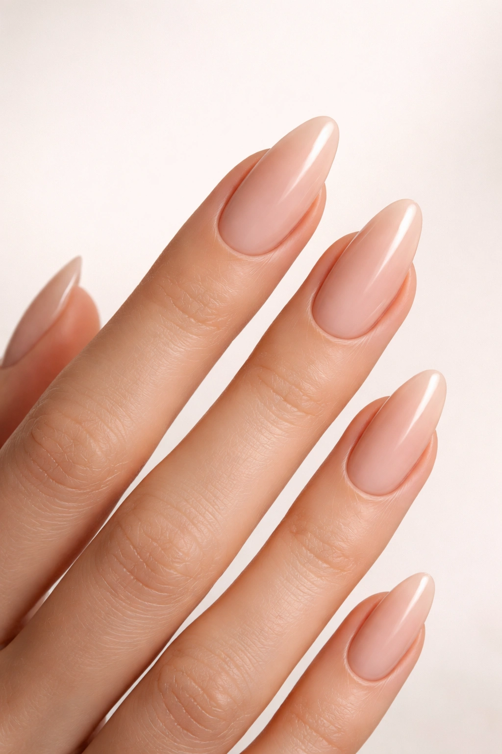 Hand with almond-shaped nails on long fingers