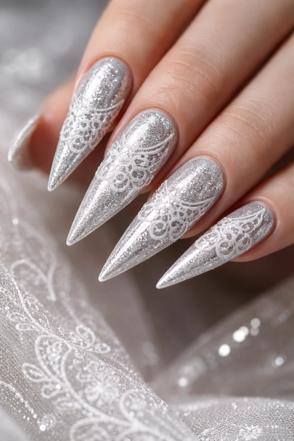 Stiletto nails with silver base and white lace details