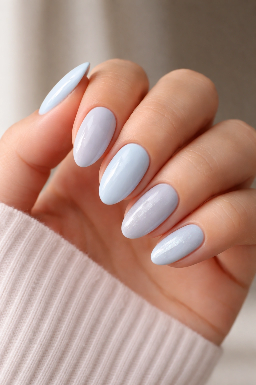 Forearm showing several baby blue nail shades to illustrate undertone matching.