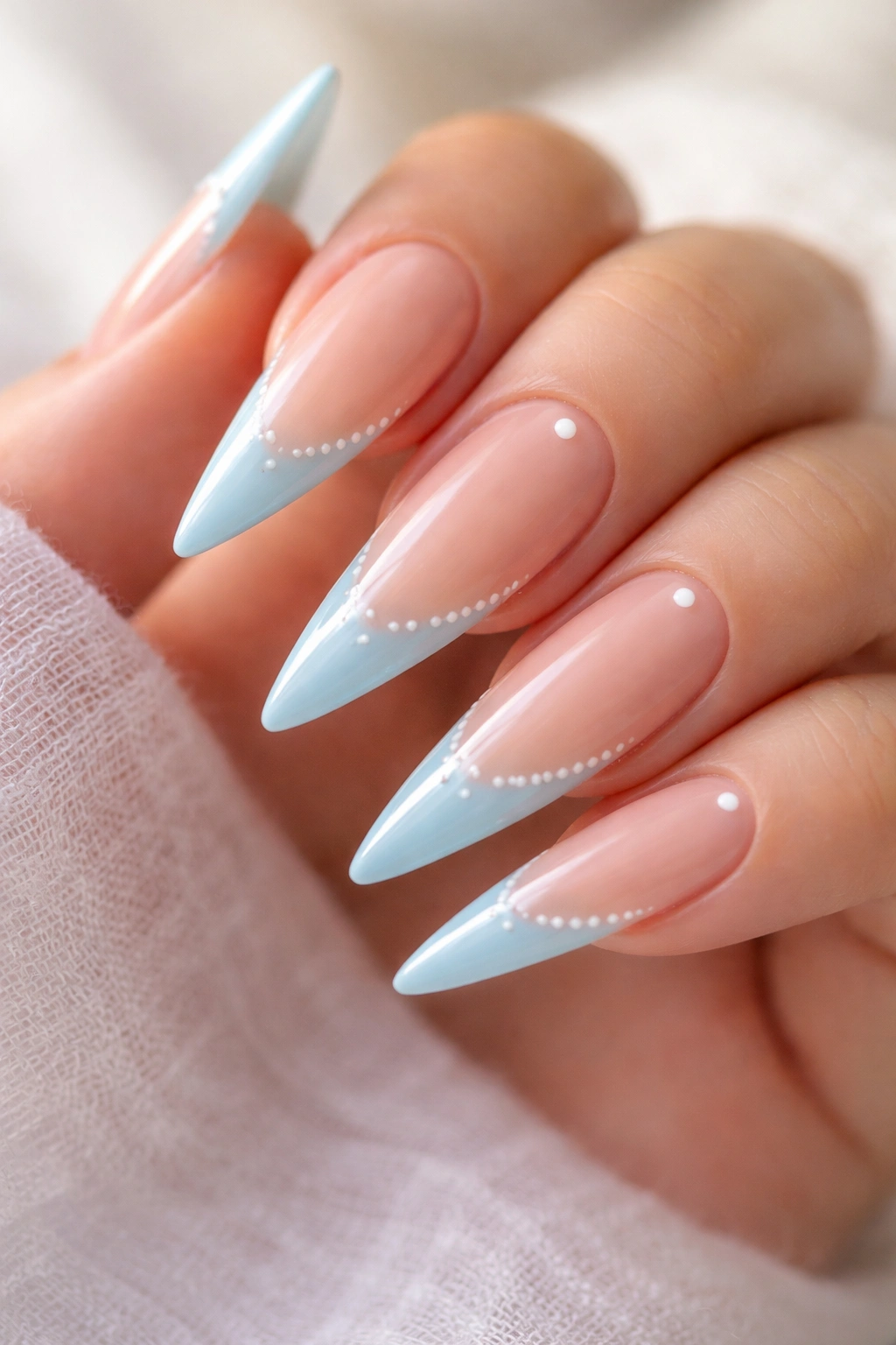 Sky blue French tips with white minimalist dots on nails
