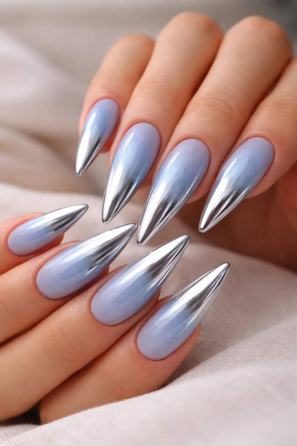 Sky blue to silver chrome ombre on stiletto nails
