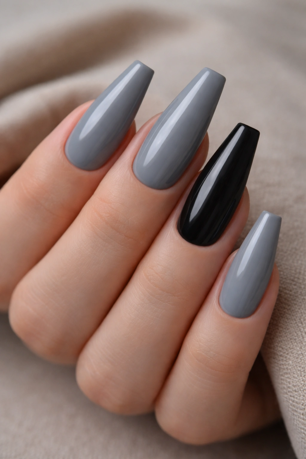Close-up of slate gray coffin nails with a single black accent.