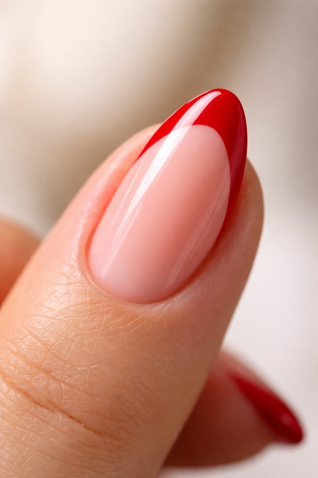 Macro shot of short almond nail showing a deep curved red smile line