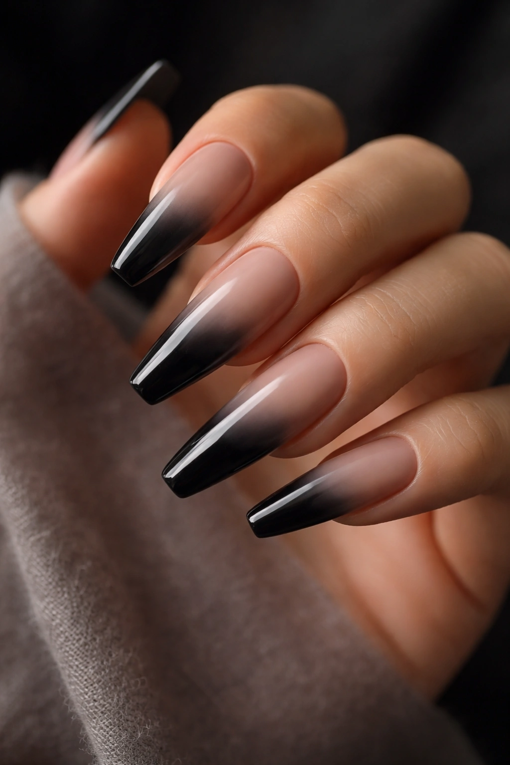 Smoky black-to-nude ombre on long ballerina nails