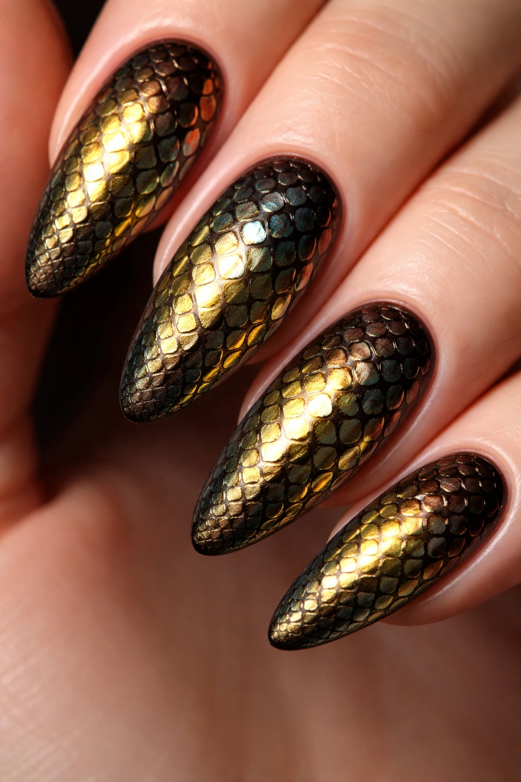 Close-up of snake print nail design with metallic scale pattern.