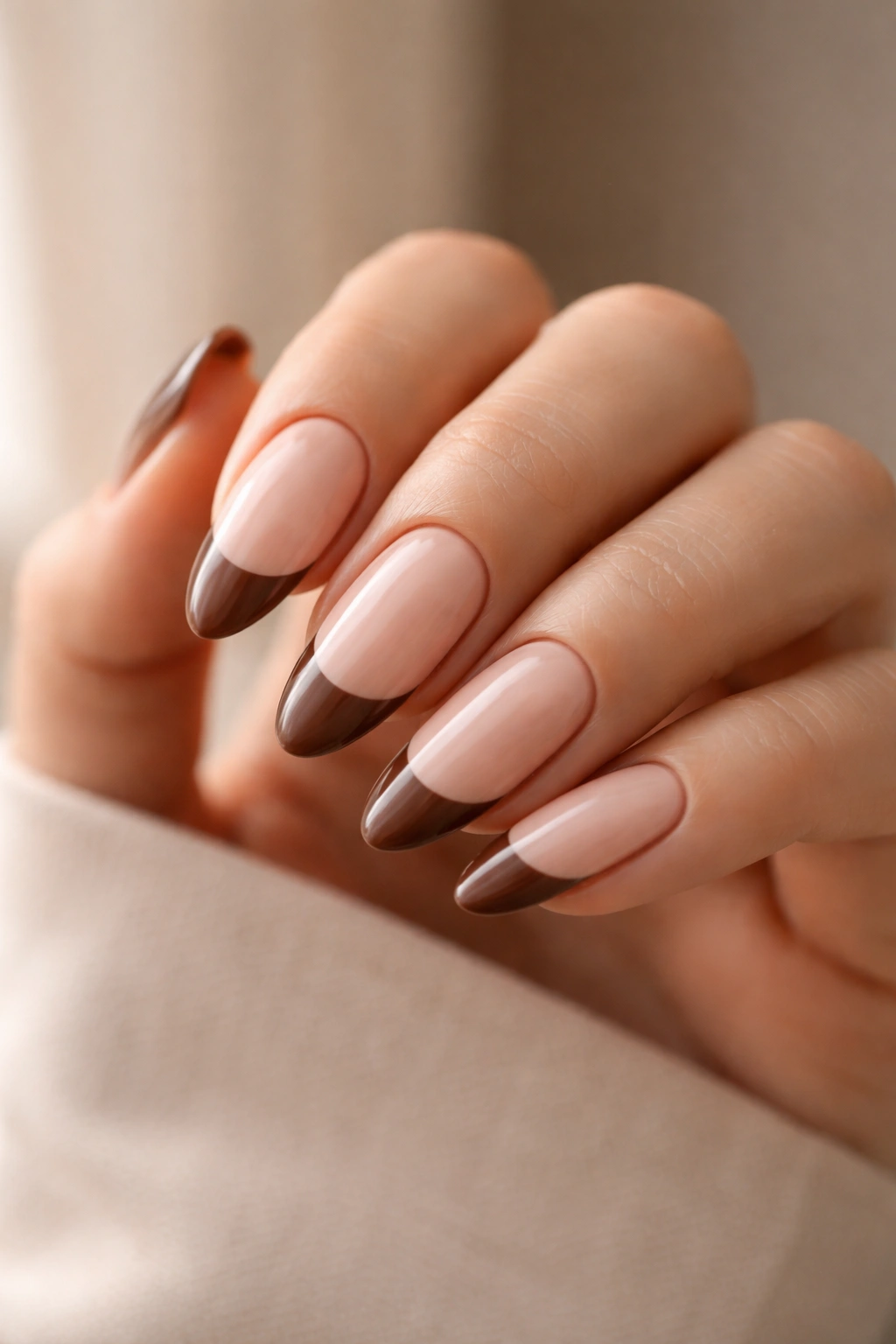 Almond nails with soft brown tips on beige base