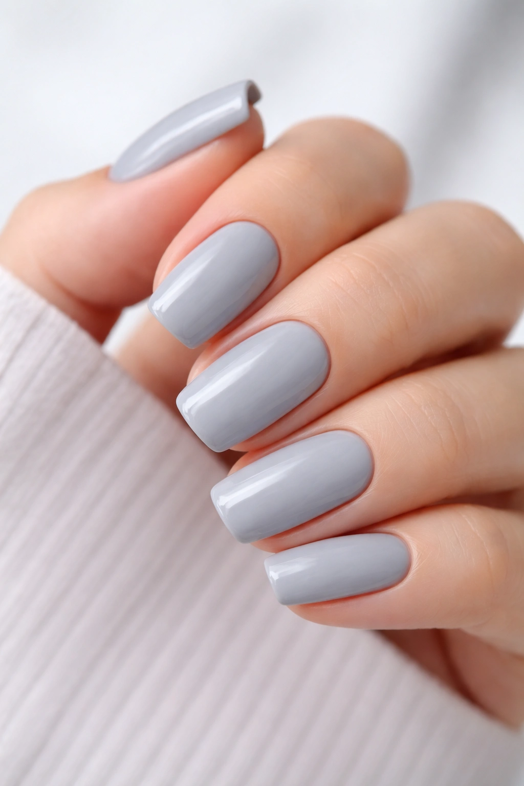 Close-up of nails painted soft gray
