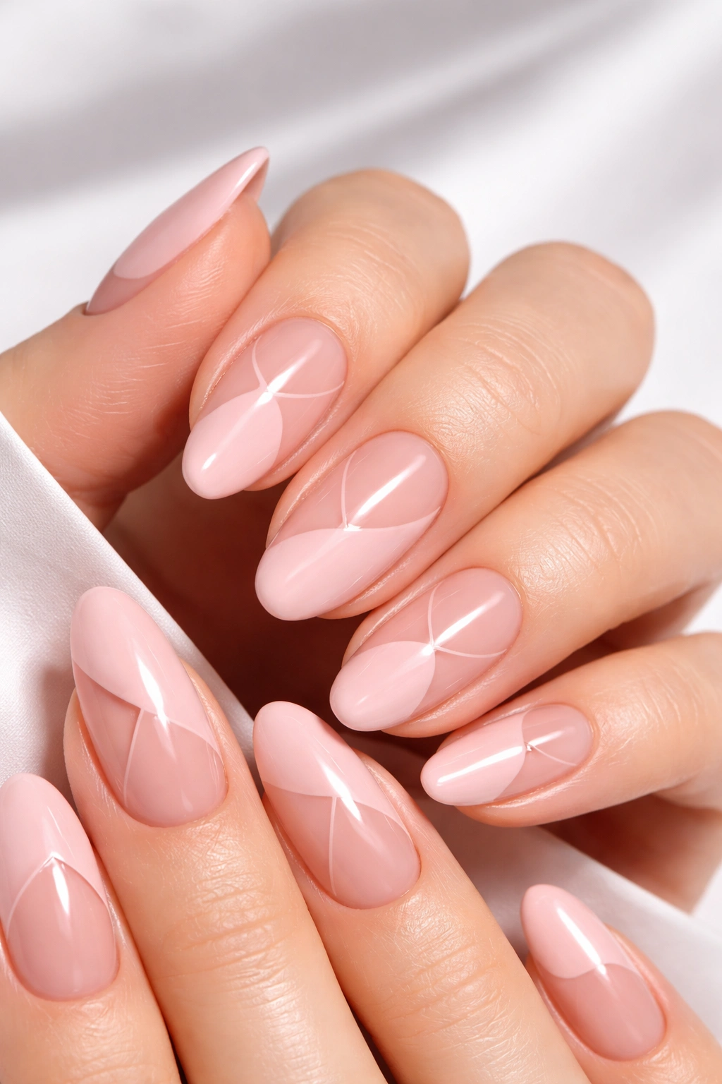Close-up of soft pink nails with negative space design