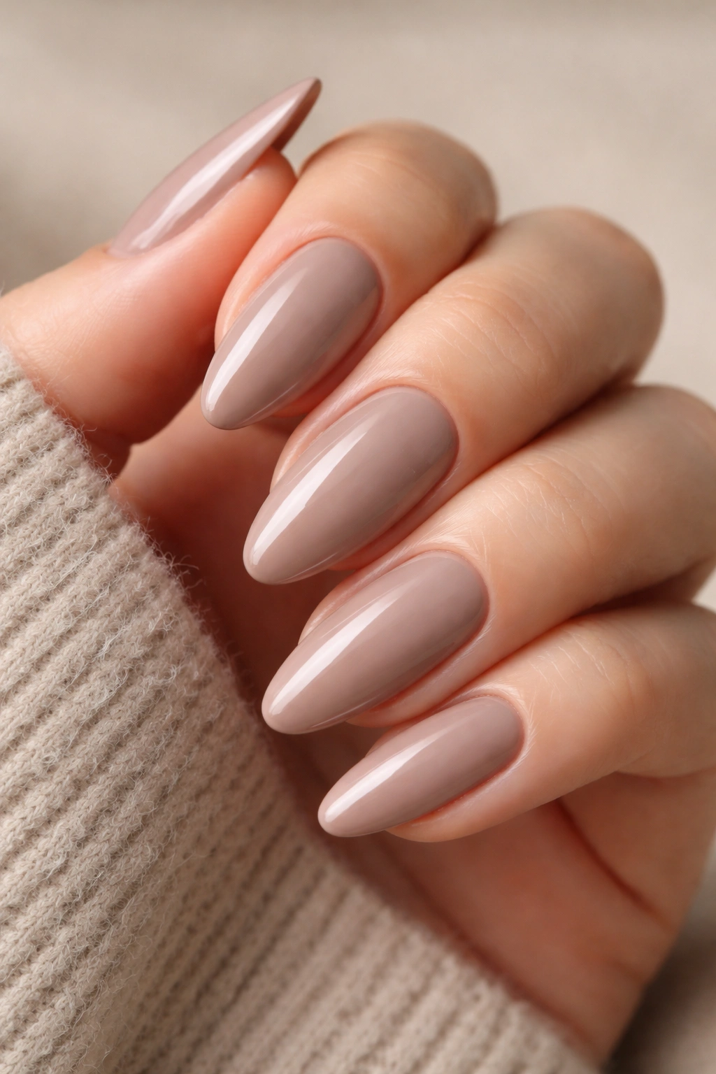 Tapered oval nails in soft taupe with glossy finish