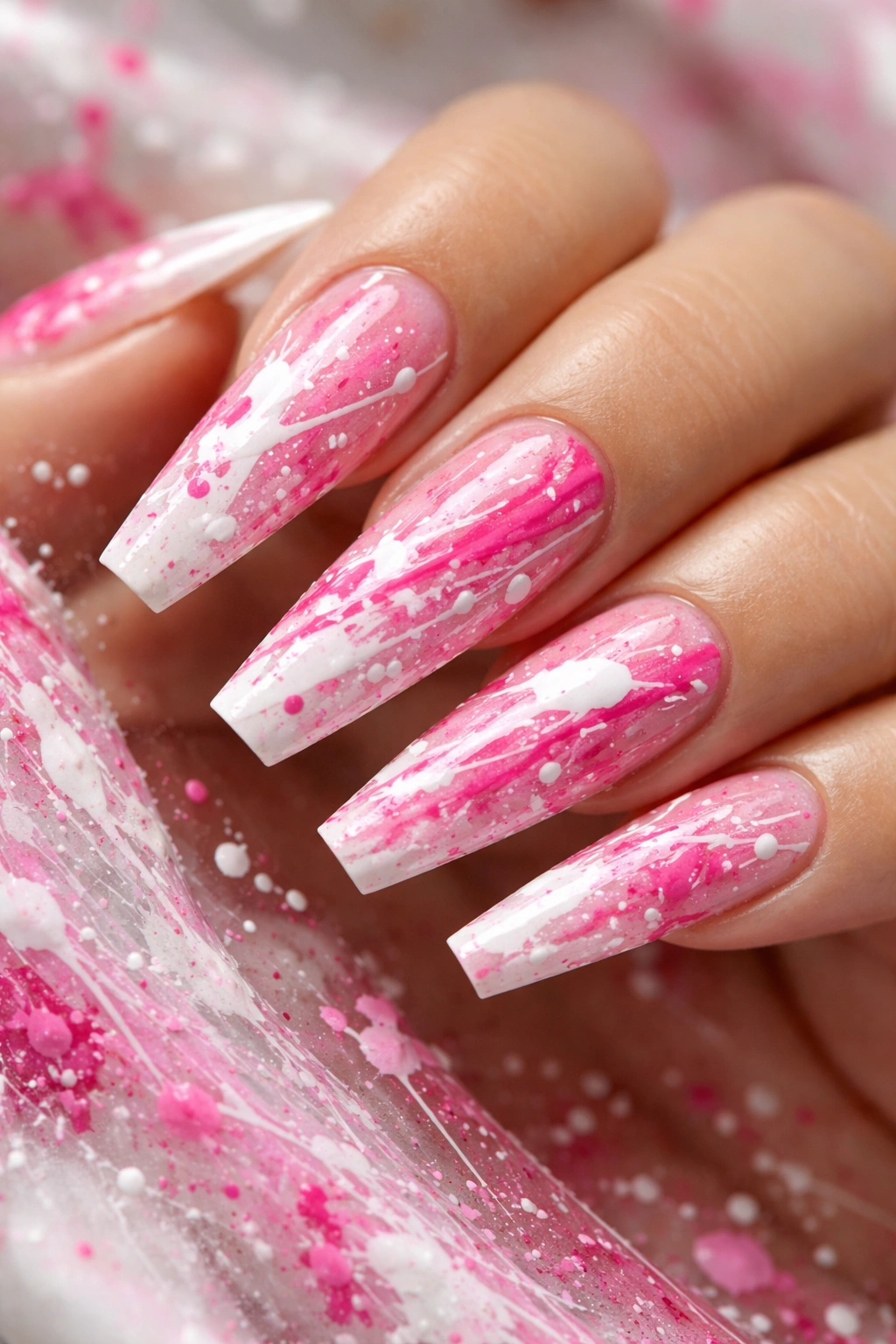 Coffin nails with pink and white splatter art