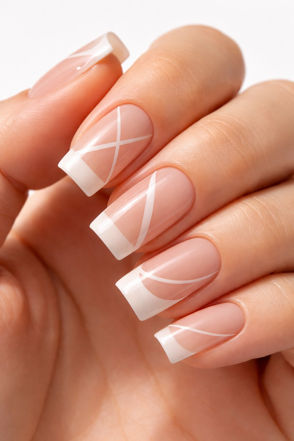 Square nails with negative space geometric design on a hand