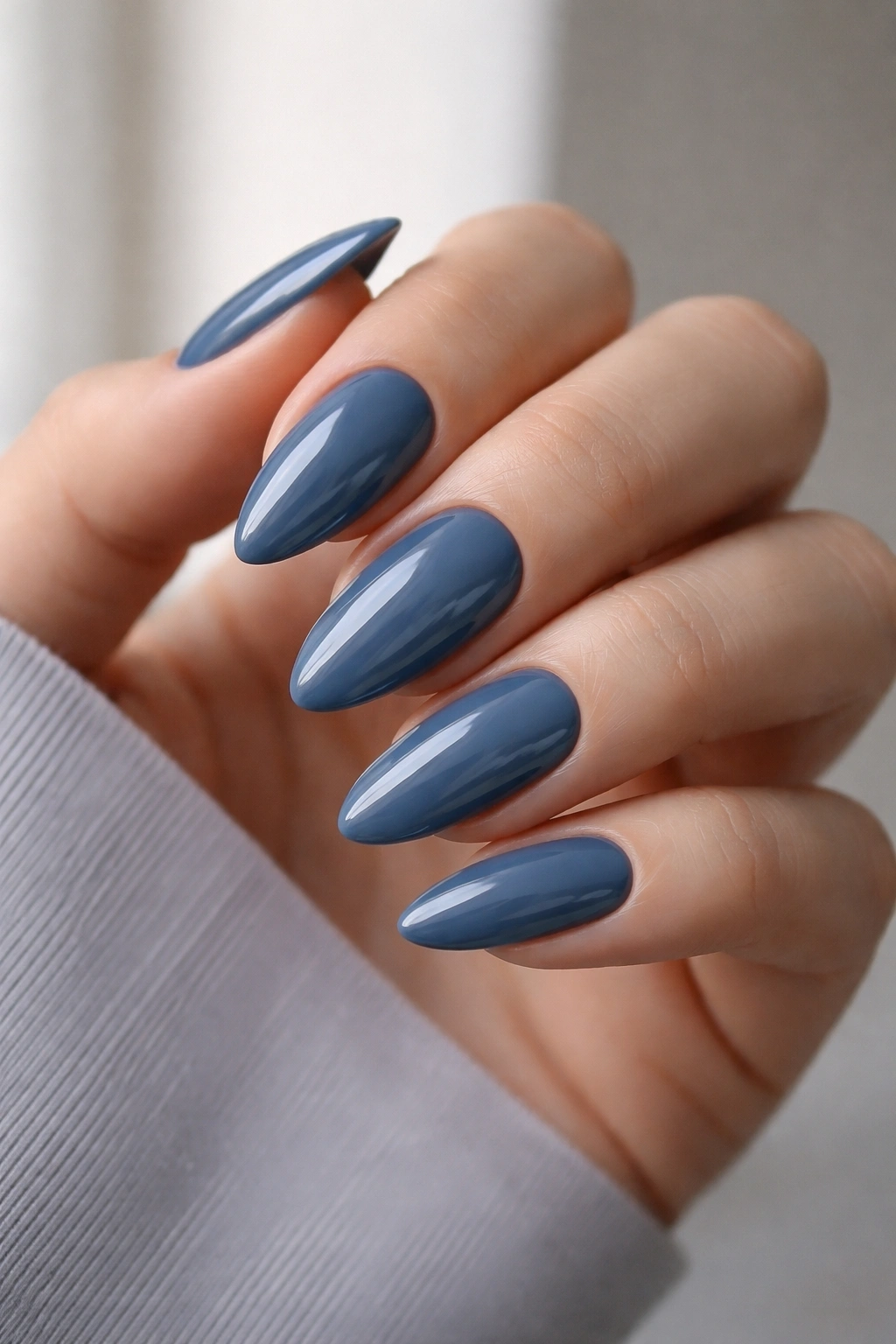 Steel blue almond nails with glossy finish