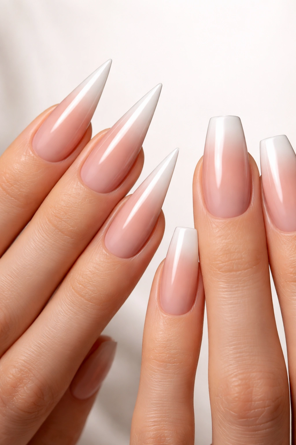 Slim fingers with stiletto and coffin nail shapes