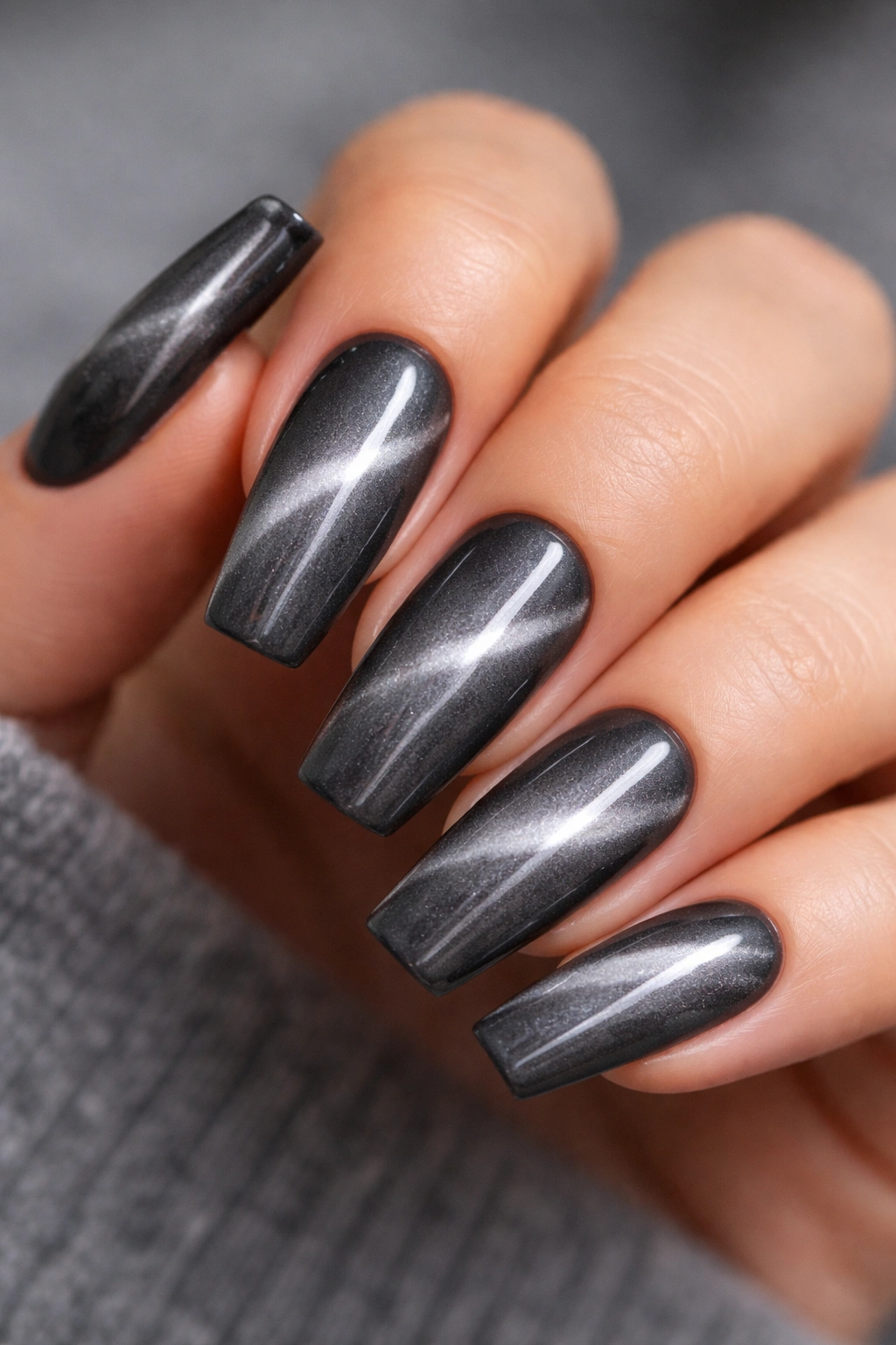 Stormy grey cat-eye nails with diagonal light pull on ballerina nails