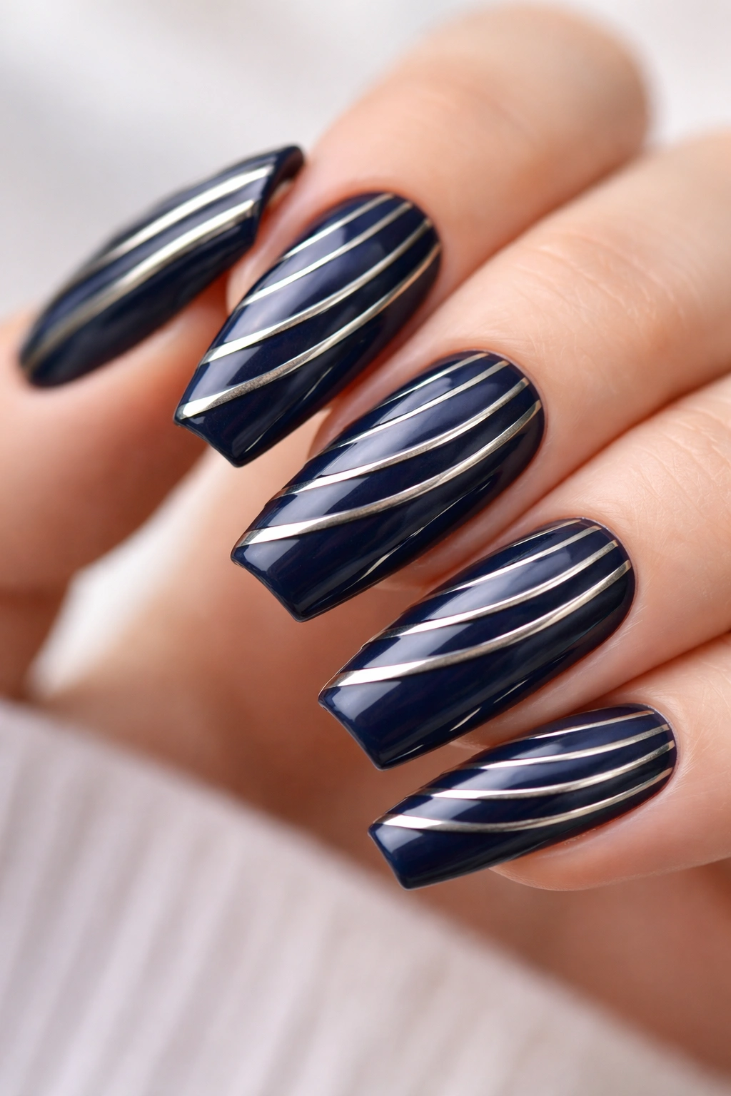Navy curved coffin nails with parallel metallic stripes