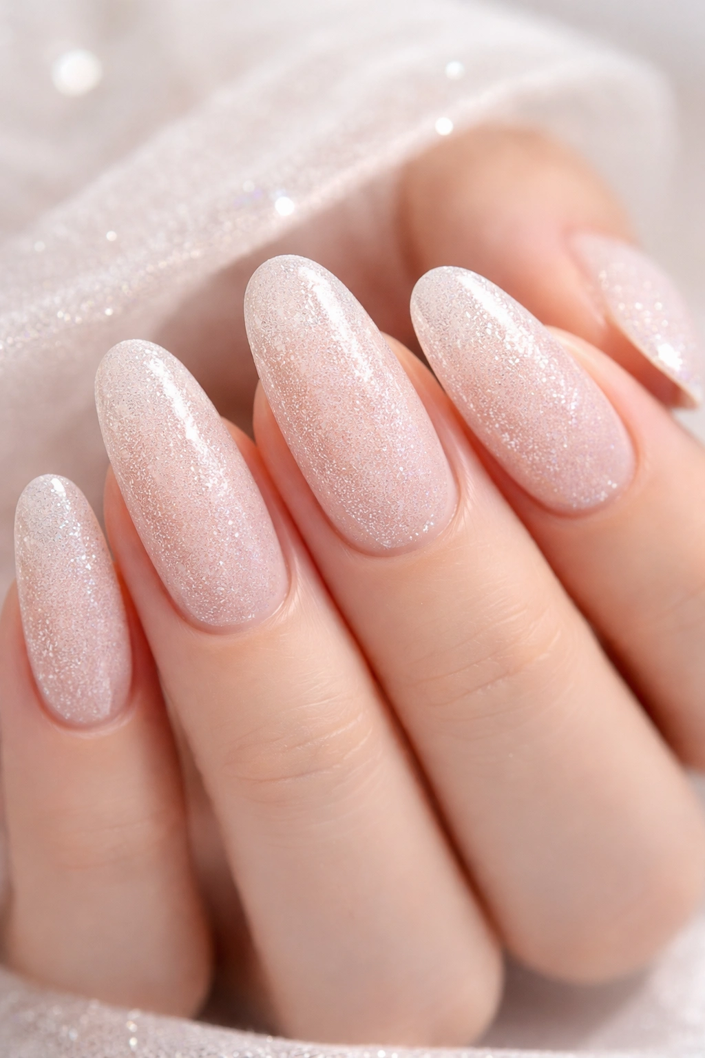 Close-up of sugar nails on long round nails with textured surface