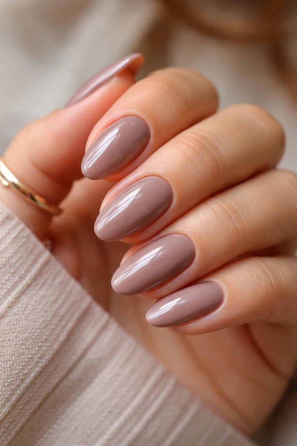 Taupe almond nails with glossy glaze finish