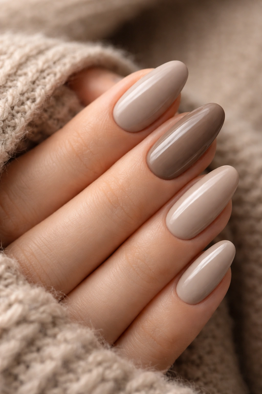 Close-up of taupe and greige nails with cool undertones.