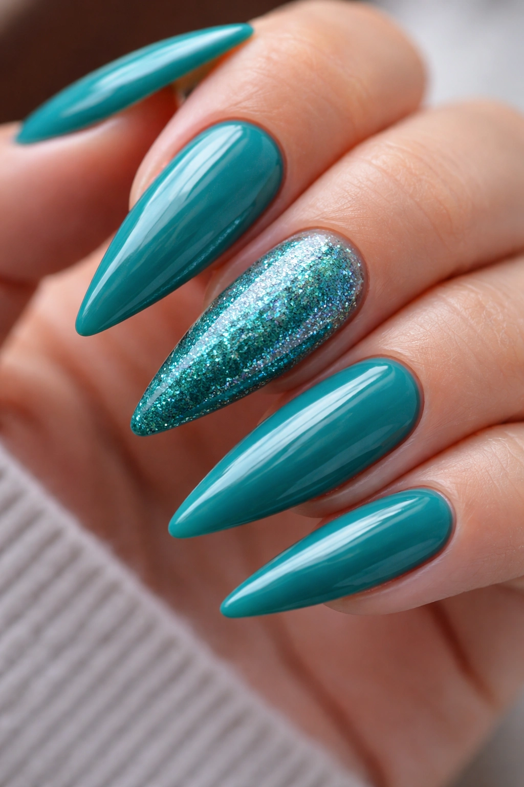 Teal nails with glitter gradient on the accent nail