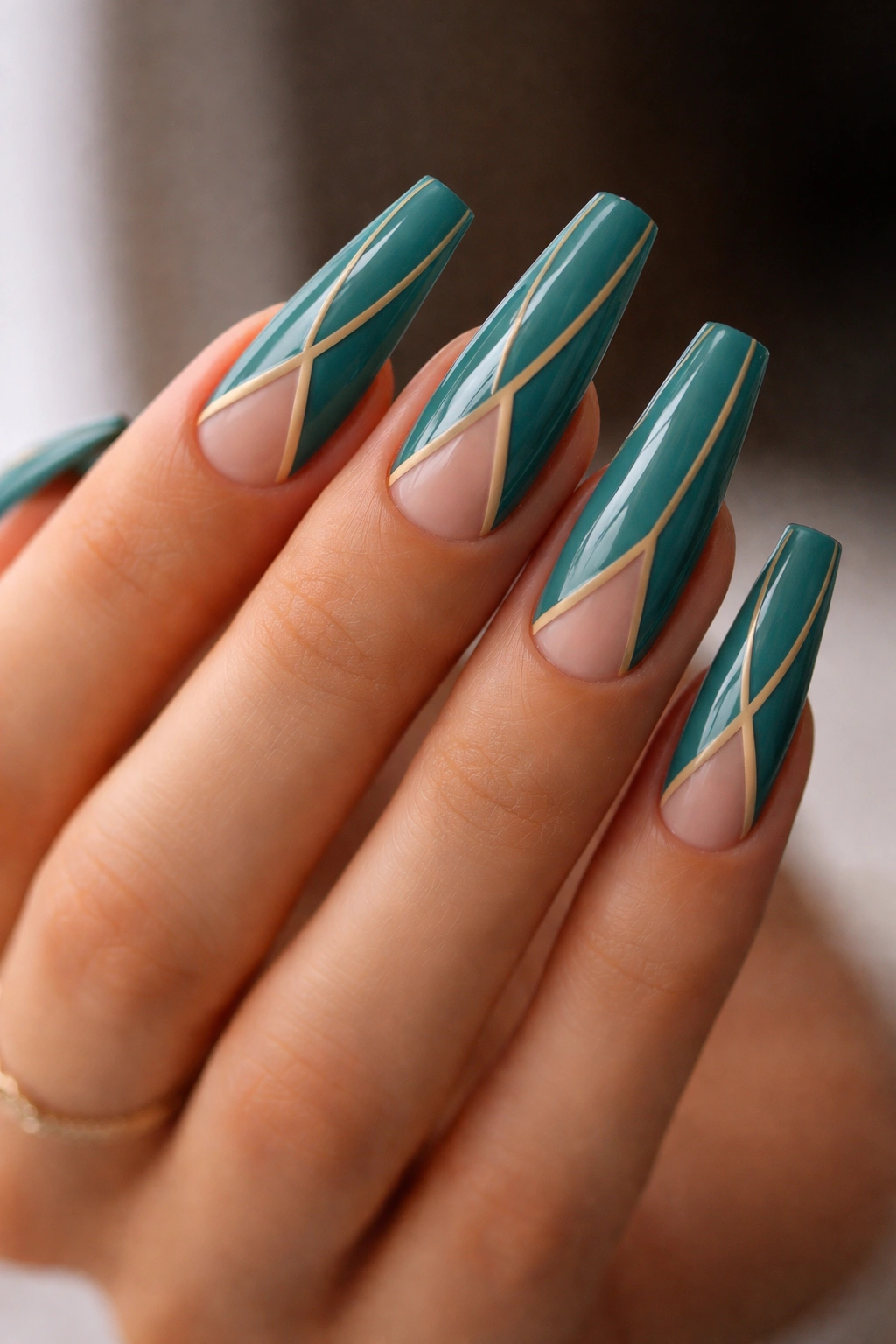Teal coffin nails with negative-space lines