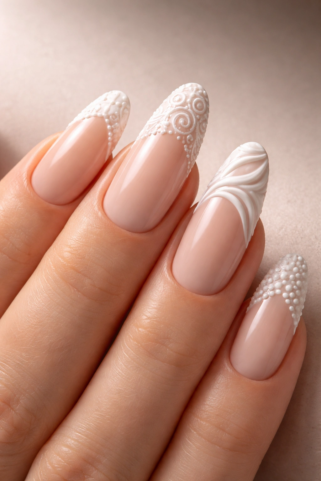 Close-up of nails with textured 3D French tips in matte and gloss finishes