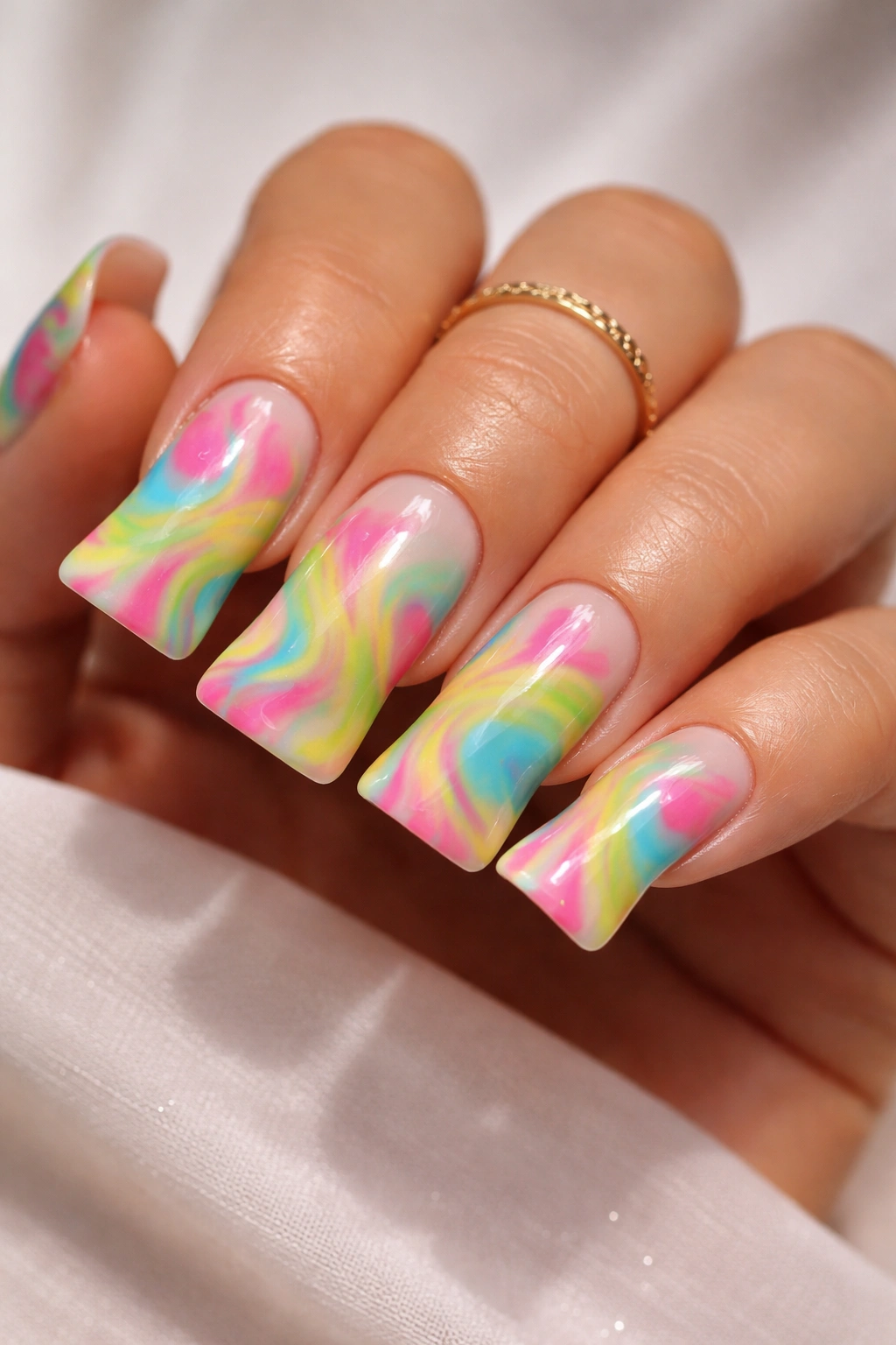 Tie-dye pattern on duck nails with neon and pastel swirls