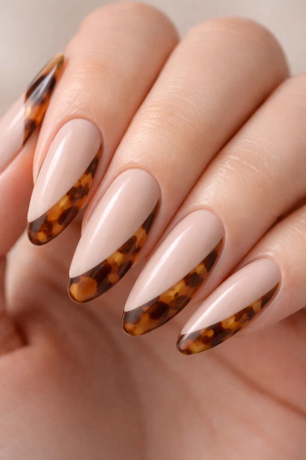 Close-up of nails with tortoiseshell pattern on outer edge