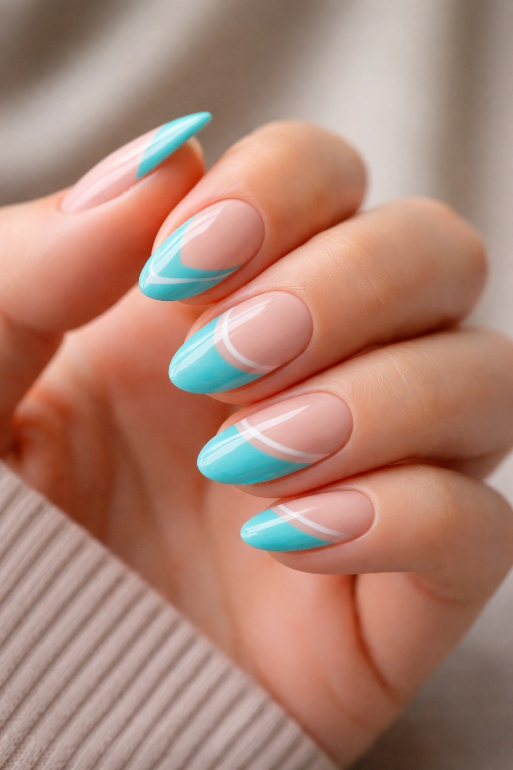 Turquoise nails with nude negative space design on short almond nails