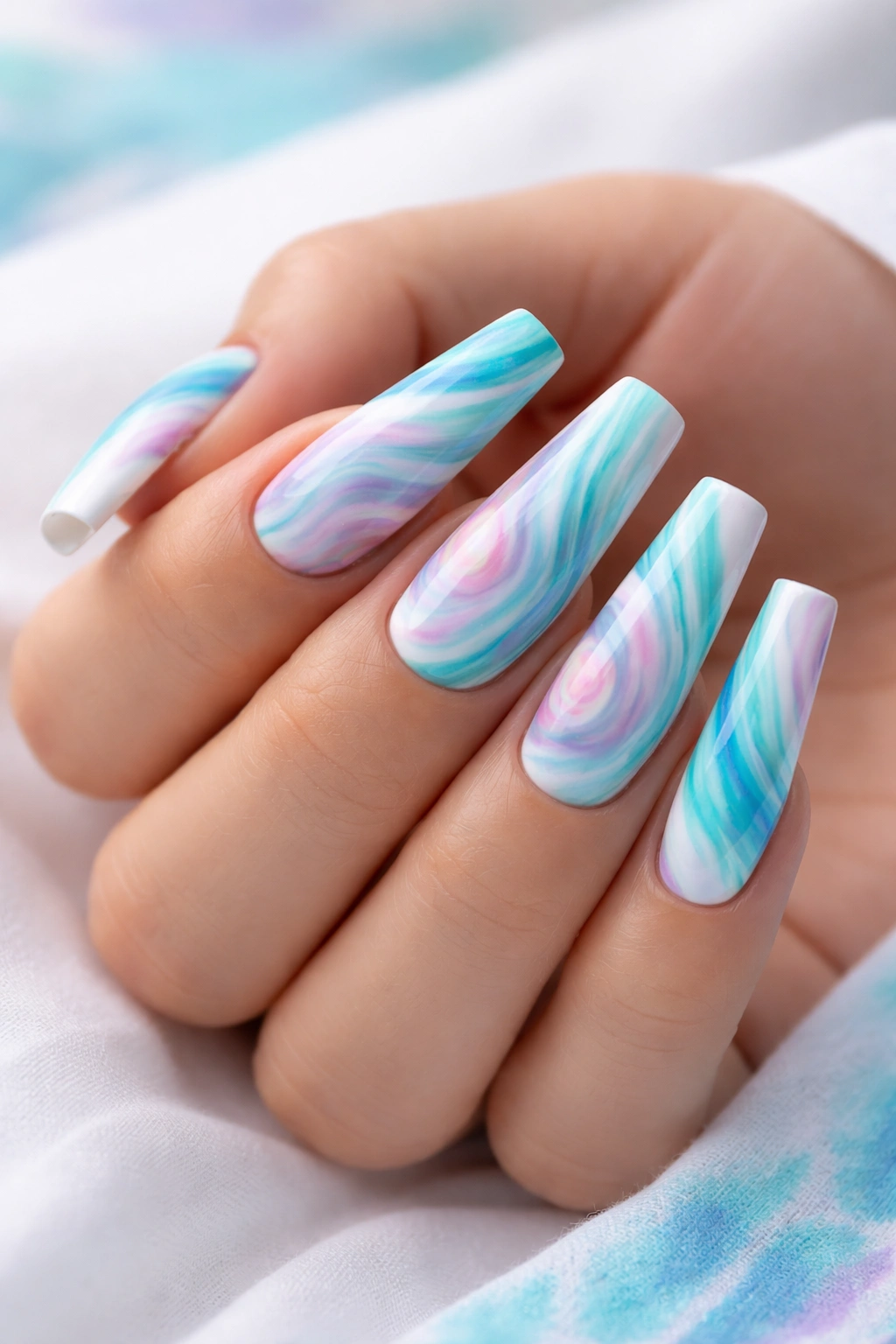 Turquoise tie-dye nail art on coffin nails