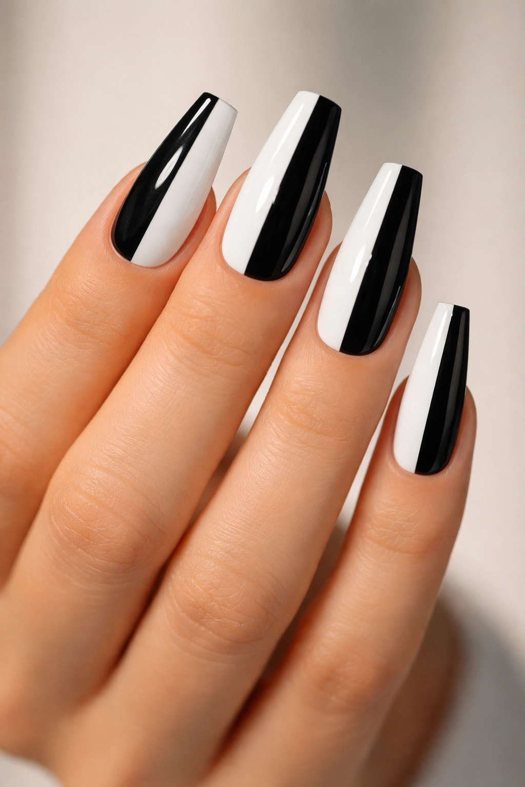 Close-up of coffin nails with a vertical black and white tuxedo split